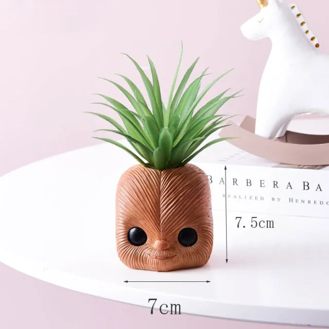 Artificial plants in cute ceramic planters